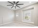 Bedroom with ceiling fan and window seat at 2648 Tanglewood Trl, Palm Harbor, FL 34685