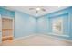 Blue bedroom with window seat and closet at 2648 Tanglewood Trl, Palm Harbor, FL 34685