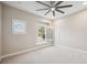 Spacious bedroom with ceiling fan and window seat at 2648 Tanglewood Trl, Palm Harbor, FL 34685