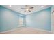 Blue bedroom with window seat and ceiling fan at 2648 Tanglewood Trl, Palm Harbor, FL 34685