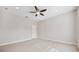 Light and airy bedroom with neutral walls and ceiling fan at 2648 Tanglewood Trl, Palm Harbor, FL 34685