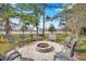 Community fire pit with surrounding seating at 2648 Tanglewood Trl, Palm Harbor, FL 34685