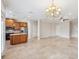 Kitchen with wood cabinets, granite counters, and stainless steel appliances at 2648 Tanglewood Trl, Palm Harbor, FL 34685