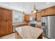 Modern kitchen with granite countertops and wood cabinets at 2648 Tanglewood Trl, Palm Harbor, FL 34685