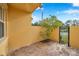 Cozy brick patio with a gate and small tree at 2648 Tanglewood Trl, Palm Harbor, FL 34685