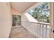 Private balcony overlooking a tree-filled backyard at 2735 Park N St, St Petersburg, FL 33710