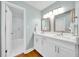 Bathroom with double vanity, quartz countertop, and a shower at 2735 Park N St, St Petersburg, FL 33710