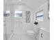 Clean bathroom with a walk-in shower and white toilet at 2735 Park N St, St Petersburg, FL 33710