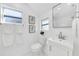 Stylish bathroom, featuring white vanity and toilet at 2735 Park N St, St Petersburg, FL 33710