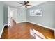 Bright bedroom with wood floors and ceiling fan at 2735 Park N St, St Petersburg, FL 33710