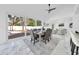 Elegant dining room with large windows and seating for six at 2735 Park N St, St Petersburg, FL 33710