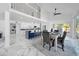 Open concept dining room with marble floors and a view of the kitchen at 2735 Park N St, St Petersburg, FL 33710