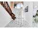 Bright and spacious entryway with marble flooring and wooden staircase at 2735 Park N St, St Petersburg, FL 33710