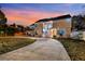 Two-story house at sunset with a long driveway at 2735 Park N St, St Petersburg, FL 33710