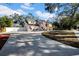 Two-story house with a long driveway and mature trees at 2735 Park N St, St Petersburg, FL 33710