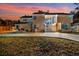 Two-story house exterior at sunset, featuring landscaping and a driveway at 2735 Park N St, St Petersburg, FL 33710