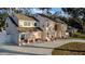 Two-story house with a side view showcasing garage and landscaping at 2735 Park N St, St Petersburg, FL 33710