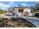 Two-story house with a large driveway and landscaped yard at 2735 Park N St, St Petersburg, FL 33710