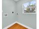 Simple laundry room with wood flooring and a window at 2735 Park N St, St Petersburg, FL 33710