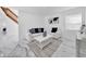 Comfortable living room featuring white sofas, a coffee table, and marble floors at 2735 Park N St, St Petersburg, FL 33710