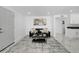 Living room with gray sofa, coffee table, and marble floor at 2735 Park N St, St Petersburg, FL 33710