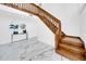 Modern staircase with wood railing and marble flooring at 2735 Park N St, St Petersburg, FL 33710