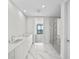 Elegant bathroom with marble floors and a walk-in shower at 2910 W Barcelona St # 2102, Tampa, FL 33629