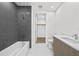 Modern bathroom with gray tile and a soaking tub at 2910 W Barcelona St # 2102, Tampa, FL 33629