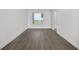 Serene bedroom with hardwood floors and large window with city views at 2910 W Barcelona St # 2102, Tampa, FL 33629