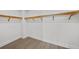 Large walk-in closet with wood shelving at 2910 W Barcelona St # 2102, Tampa, FL 33629