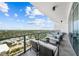 Spacious balcony with outdoor furniture and city views at 2910 W Barcelona St # 2102, Tampa, FL 33629