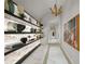 Bright hallway with marble floors and modern art at 2910 W Barcelona St # 2102, Tampa, FL 33629