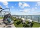 Relaxing lounge area with hanging chairs and breathtaking water views at 2910 W Barcelona St # 2102, Tampa, FL 33629