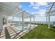 Luxury rooftop pool area with pergola and lush green landscaping at 2910 W Barcelona St # 2102, Tampa, FL 33629