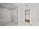 Walk-in shower with marble tile and glass enclosure at 2910 W Barcelona St # 2102, Tampa, FL 33629