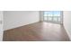 Hardwood floors and large windows are featured in this bright bedroom at 2910 W Barcelona St # Ph-2302, Tampa, FL 33629