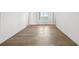 Hardwood floor hallway with access to bedroom and other rooms at 2910 W Barcelona St # Ph-2302, Tampa, FL 33629