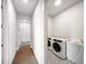 Laundry room with washer, dryer, and modern cabinetry at 2910 W Barcelona St # Ph-2302, Tampa, FL 33629