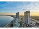 Aerial perspective of city skyline, bay, and construction at 2910 W Barcelona St # Ph-2303, Tampa, FL 33629