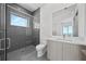 Modern bathroom with gray tile, walk-in shower, and floating vanity at 2910 W Barcelona St # Ph-2303, Tampa, FL 33629