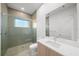 Contemporary bathroom with a walk-in shower and wood vanity at 2910 W Barcelona St # Ph-2303, Tampa, FL 33629