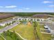 Aerial view of houses, playground, and green spaces at 3304 Suncoast Plains Dr, Odessa, FL 33556