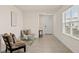 Bright foyer with tile floors and seating area at 3304 Suncoast Plains Dr, Odessa, FL 33556