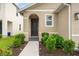 Dark brown front door with a walkway and landscaping at 3304 Suncoast Plains Dr, Odessa, FL 33556