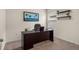 Home office with desk, chair, and shelving at 3304 Suncoast Plains Dr, Odessa, FL 33556