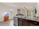 Kitchen island with granite countertop and stainless steel sink at 3304 Suncoast Plains Dr, Odessa, FL 33556