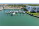 Aerial view showcasing boat slips and building location at 340 Pinellas Bayway S # 306, Tierra Verde, FL 33715