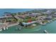 Aerial view showing building location, pool, and marina access at 340 Pinellas Bayway S # 306, St Petersburg, FL 33715