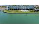 Aerial view of building, pool, and waterfront location at 340 Pinellas Bayway S # 306, St Petersburg, FL 33715