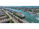 Aerial view of waterfront property with boat slips and pool at 340 Pinellas Bayway S # 306, St Petersburg, FL 33715